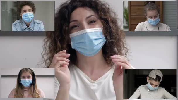Enseignement à distance. Sur l'écran du moniteur, l'enseignant et les élèves portent des masques protecteurs. Prévention de l'infection à coronavirus. — Video