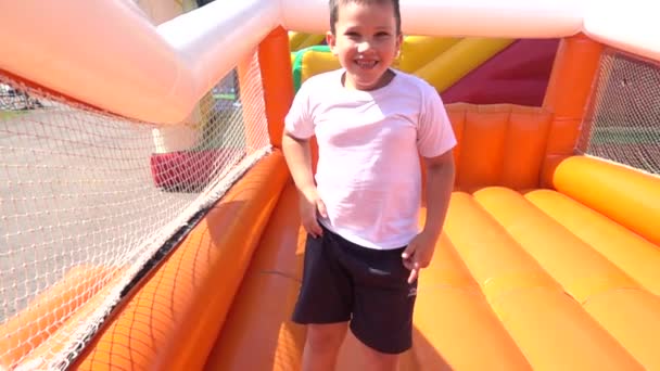 Menino feliz em um playground — Vídeo de Stock