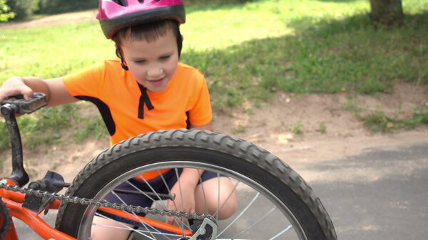 Boy spinning Bicycle wheel