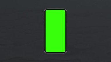 Önü boş yeşil ekranlı akıllı telefon, masa üstü siyah ahşaptan yapılmış. 4K animasyon, tasarım ekranındaki sunum için hareketleri izler. 3 Boyutlu Hazırlama