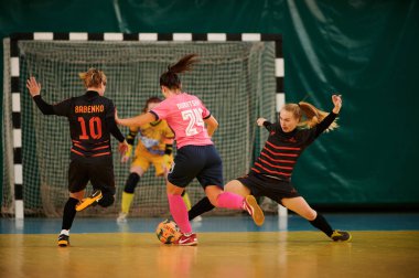 KHARKIV, UKRAINE - NOVEMBER 6, 2020: Futsal. Ukrainian women cup. Tesla vs IMS clipart