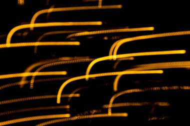 Altın ışık yollarının arka planı. Işık izleri. Boşluğu kopyala. 