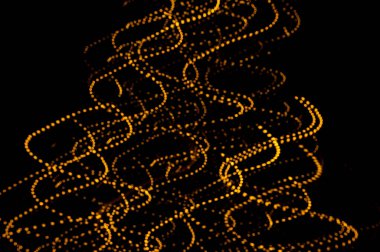 Altın ışık yollarının arka planı. Işık izleri. Boşluğu kopyala. 