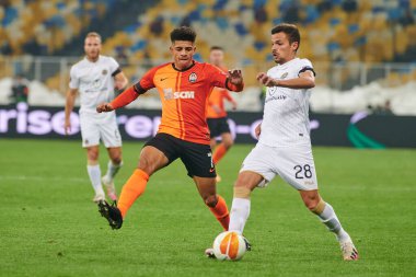 KYIV, UKRAINE - FEBRUARY 25, 2021: Taison vs Andre Geraldes. NSC Olympic. The football match of UEFA Europa League FC Shakhtar - Maccabi Tel Aviv FC