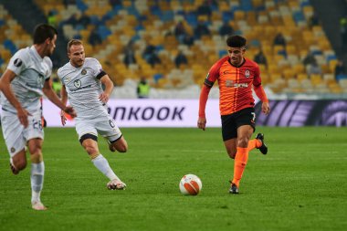 KYIV, UKRAINE - FEBRUARY 25, 2021: Dan Glaser vs Taison. NSC Olympic. The football match of UEFA Europa League FC Shakhtar - Maccabi Tel Aviv FC