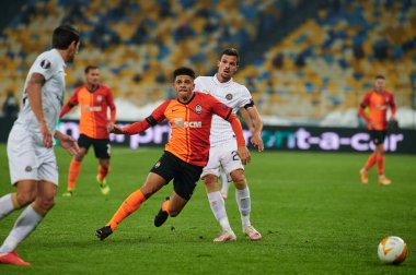 KYIV, UKRAINE - FEBRUARY 25, 2021: Taison vs Andre Geraldes. NSC Olympic. The football match of UEFA Europa League FC Shakhtar - Maccabi Tel Aviv FC