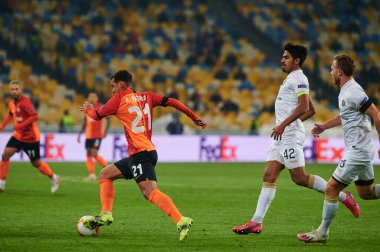 KYIV, UKRAINE - FEBRUARY 25, 2021: Alan Patrick vs Dor Peretz. NSC Olympic. The football match of UEFA Europa League FC Shakhtar - Maccabi Tel Aviv FC