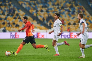 KYIV, UKRAINE - FEBRUARY 25, 2021: Alan Patrick vs Dor Peretz. NSC Olympic. The football match of UEFA Europa League FC Shakhtar - Maccabi Tel Aviv FC