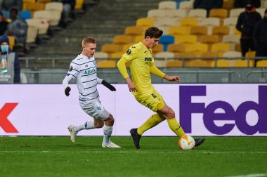 KYIV, UKRAINE - MARCH 11, 2021:4 defender Pau Torres vs 29 midfielder Vitaliy Buyalskiy during the match of UEFA Europa League Dynamo Kyiv vs Villarreal at NSC Olympic in Kyiv