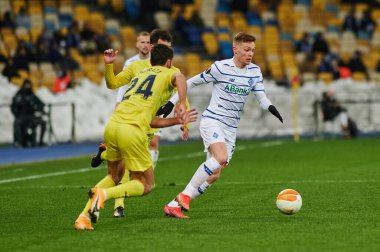 KYIV, UKRAINE - MARCH 11, 2021:15 midfielder Viktor Tsygankov vs 24 midfielder Alfonso Pedraza during the match of UEFA Europa League Dynamo Kyiv vs Villarreal at NSC Olympic in Kyiv