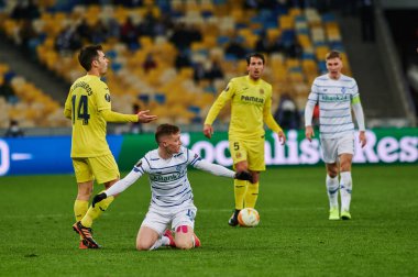 KYIV, UKRAINE - MARCH 11, 2021:15 midfielder Viktor Tsygankov vs 14 midfielder Manu Trigueros during the match of UEFA Europa League Dynamo Kyiv vs Villarreal at NSC Olympic in Kyiv