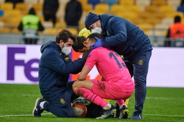 KYIV, UKRAINE - MARCH 11, 2021: 13 goalkeeper Geronimo Rulli injuring and receives medical help during the match of UEFA Europa League Dynamo Kyiv vs Villarreal at NSC Olympic in Kyiv