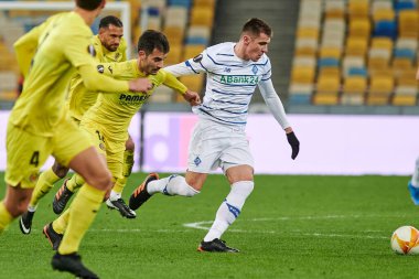 KYIV, UKRAINE - MARCH 11, 2021:14 midfielder Manu Trigueros vs 41 forward Artem Besedin during the match of UEFA Europa League Dynamo Kyiv vs Villarreal at NSC Olympic in Kyiv