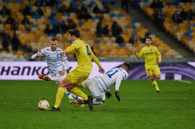 KYIV, UKRAINE - MARCH 11, 2021:4 defender Pau Torres vs 41 forward Artem Besedin and 94 defender Tomasz Kedziora during the match of UEFA Europa League Dynamo Kyiv vs Villarreal at NSC Olympic in Kyiv