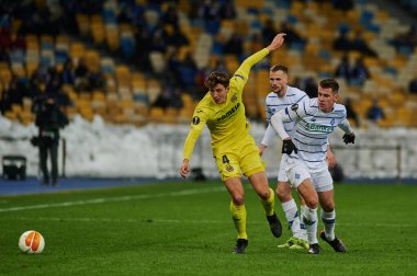 KYIV, UKRAINE - MARCH 11, 2021:4 defender Pau Torres vs 41 forward Artem Besedin and 94 defender Tomasz Kedziora during the match of UEFA Europa League Dynamo Kyiv vs Villarreal at NSC Olympic in Kyiv