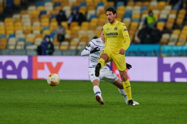 KYIV, UKRAINE - MARCH 11, 2021:5 midfielder Daniel Parejo vs 29 midfielder Vitaliy Buyalskiy during the match of UEFA Europa League Dynamo Kyiv vs Villarreal at NSC Olympic in Kyiv