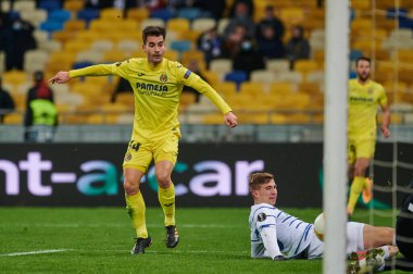 KYIV, UKRAINE - MARCH 11, 2021:14 midfielder Manu Trigueros vs 25 defender Illia Zabarnyi during the match of UEFA Europa League Dynamo Kyiv vs Villarreal at NSC Olympic in Kyiv