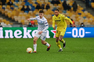 KYIV, UKRAINE - MARCH 11, 2021:25 midfielder Etienne Capoue vs 10 midfielder Mykola Shaparenko during the match of UEFA Europa League Dynamo Kyiv vs Villarreal at NSC Olympic in Kyiv