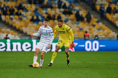 KYIV, UKRAINE - MARCH 11, 2021:25 midfielder Etienne Capoue vs 10 midfielder Mykola Shaparenko during the match of UEFA Europa League Dynamo Kyiv vs Villarreal at NSC Olympic in Kyiv