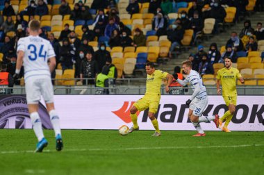 KYIV, UKRAINE - MARCH 11, 2021: 9 forward Carlos Bacca vs 25 defender Illia Zabarnyi during the match of UEFA Europa League Dynamo Kyiv vs Villarreal at NSC Olympic in Kyiv