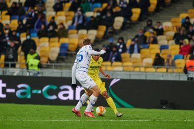 KYIV, UKRAINE - MARCH 11, 2021: 9 forward Carlos Bacca vs 25 defender Illia Zabarnyi during the match of UEFA Europa League Dynamo Kyiv vs Villarreal at NSC Olympic in Kyiv