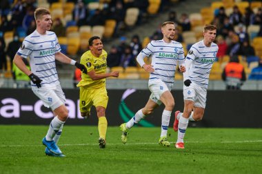 KYIV, UKRAINE - MARCH 11, 2021: 9 forward Carlos Bacca vs 25 defender Illia Zabarnyi, 94 defender Tomasz Kedziora during the match of UEFA Europa League Dynamo Kyiv vs Villarreal at NSC Olympic in Kyiv