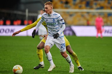 KYIV, UKRAINE - MARCH 11, 2021:25 midfielder Etienne Capoue vs 29 midfielder Vitaliy Buyalskiy during the match of UEFA Europa League Dynamo Kyiv vs Villarreal at NSC Olympic in Kyiv