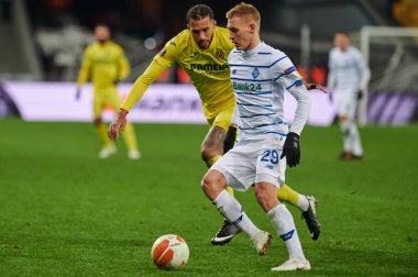 KYIV, UKRAINE - MARCH 11, 2021:25 midfielder Etienne Capoue vs 29 midfielder Vitaliy Buyalskiy during the match of UEFA Europa League Dynamo Kyiv vs Villarreal at NSC Olympic in Kyiv