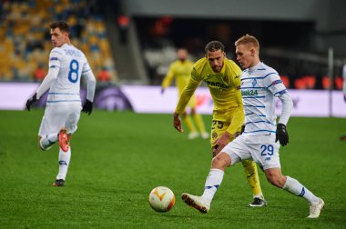 KYIV, UKRAINE - MARCH 11, 2021:25 midfielder Etienne Capoue vs 29 midfielder Vitaliy Buyalskiy during the match of UEFA Europa League Dynamo Kyiv vs Villarreal at NSC Olympic in Kyiv