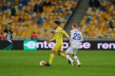 KYIV, UKRAINE - MARCH 11, 2021:5 midfielder Daniel Parejo vs 29 midfielder Vitaliy Buyalskiy during the match of UEFA Europa League Dynamo Kyiv vs Villarreal at NSC Olympic in Kyiv
