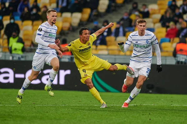 KYIV, UKRAINE - MARCH 11, 2021: 9 forward Carlos Bacca vs 25 defender Illia Zabarnyi, 94 defender Tomasz Kedziora during the match of UEFA Europa League Dynamo Kyiv vs Villarreal at NSC Olympic in Kyiv