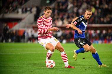 COLOGNE, GERMANY - 2 NOVEMBER, 2025: Sebastian Sebulonsen, Miro Muheim - Bundesliga 1.FC Koeln-Hamburger SV maçı Rhein Energie Stadion 'da.