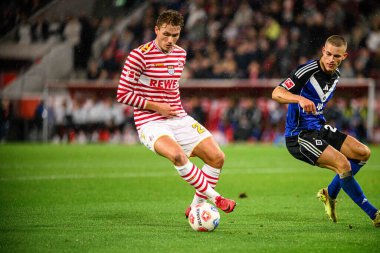 COLOGNE, GERMANY - 2 NOVEMBER, 2025: Sebastian Sebulonsen, Miro Muheim - Bundesliga 1.FC Koeln-Hamburger SV maçı Rhein Energie Stadion 'da.