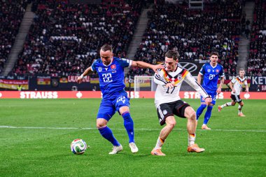 LEIPZIG, GERMANY - 17 Kasım 2025: Florian Wirtz, Stanislav Lobotka - Dünya Kupası 2026 ön eleme karşılaşması Almanya ile Slovakya arasında Red Bull Arena 'da.