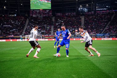 LEIPZIG, GERMANY - 17 Kasım 2025: Serge Gnabry, Stanislav Lobotka, Florian Wirtz - Dünya Kupası eleme karşılaşması 2026.