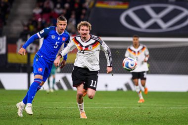 LEIPZIG, GERMANY - 17 Kasım 2025: Lubomir Satka, Nick Woltemade - Dünya Kupası eleme karşılaşması Almanya ile Slovakya arasında Red Bull Arena 'da.