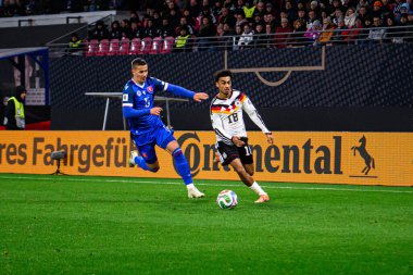 LEIPZIG, GERMANY - 17 Kasım 2025: Nathaniel Brown, Lubomir Satka - Dünya Kupası 2026 ön eleme karşılaşması Almanya ile Slovakya arasında Red Bull Arena 'da.