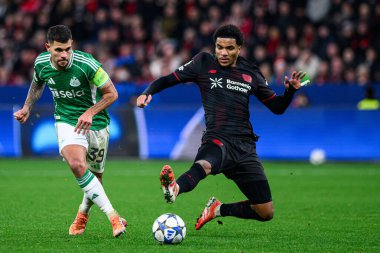 LEVERKUSEN, ALMANY - 10 ARALIK 2025: Malik Tillman, Bruno Guimaraes - UEFA Şampiyonlar Ligi, Bayer 04 Leverkusen - Newcastle United.