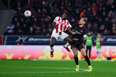 LEVERKUSEN, GERMANY - 13 Aralık 2025: Robert Andrich, Ragnar Ache - Bundesliga maçı Bayer 04 Leverkusen 'e karşı Bayena' da 1.FC Koeln.