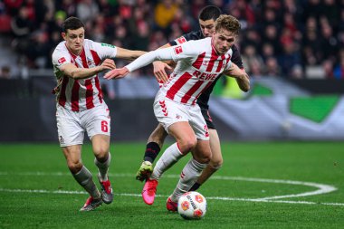 LEVERKUSEN, GERMANY - 13 ARALIK 2025: Sebastian Sebulonsen, İbrahim Maza, Eric Martel - Bundesliga maçı Bayer 04 Leverkusen - Bayarena 'da 1.FC Koeln' e karşı.