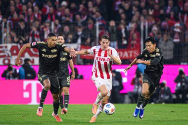 COLOGNE, ALMANY - 20 ARALIK 2025 Danilho Doekhi, Jakub Kaminski, Wooyeong Jeong - 1. Bundesliga maçı 1.FC Koeln 1 'e karşı. FC Union Berlin, Rhein Enerji Stadyumu.