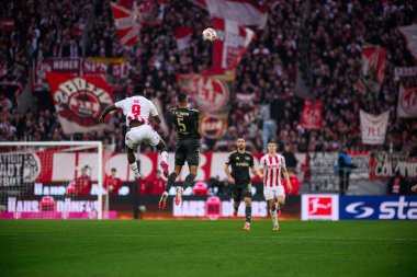 COLOGNE, Almanya - 20 ARALIK 2025 Ragnar Ache, Danilho Doekhi - 1. Bundesliga maçı 1.FC Koeln 1 'e karşı. FC Union Berlin, Rhein Enerji Stadyumu.