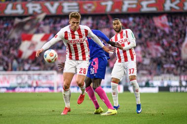 COLOGNE, GERMANY - 17 Ocak 2026: Sebastian Sebulonsen, SILAS KATOMPA MVUMPA, Linton Maina, 1. FC Koeln 1 'e karşı. Rhein Enerji Stadyumunda FSV Mainz 05