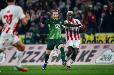 COLOGNE, Almanya - 30 HAZİRAN, 2026: Maximilian Arnold, Ragnar Ache - 1. Bundesliga futbol maçı 1. FC Koeln, VfL Wolfsburg 'a karşı. Rhein Enerji Stadyumunda.