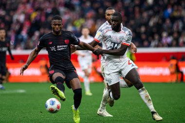 LEVERKUSEN, GERMANY - 14 Mart 2026: Christian Kofane, Dayot Upamecano - Bayer 04 Leverkusen-FC Bayern Muenchen maçı Bayena 'da.