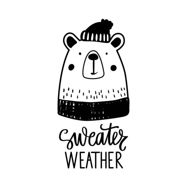 Söt doodle björn i tröja och vinter hatt. Skiss vektor illustration. Tröja väder handritade bokstäver. — Stock vektor