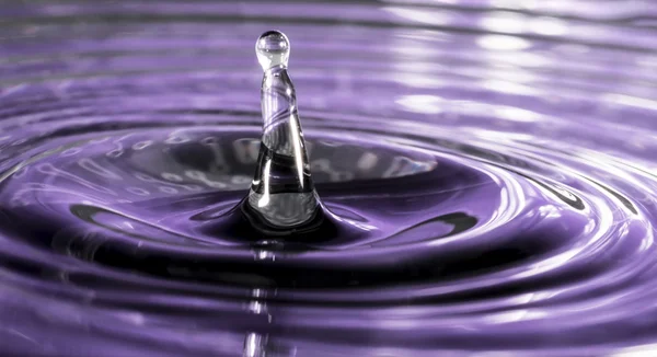 Water drop resembling helter skelter Stock Image