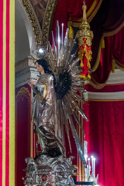 Cospicua, Malta - November 28th, 2025, Elegant Virgin Mary Statue Adorned With Gold Halo In Ornate Church Interior