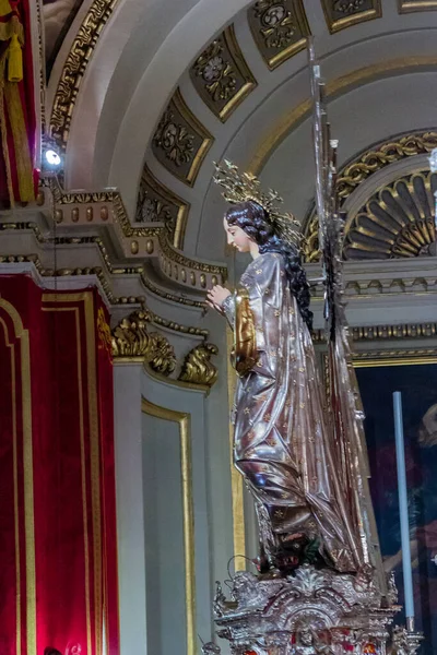 Cospicua, Malta - November 28th, 2025, Elegant Virgin Mary Statue Adorned With Gold Halo In Ornate Church Interior