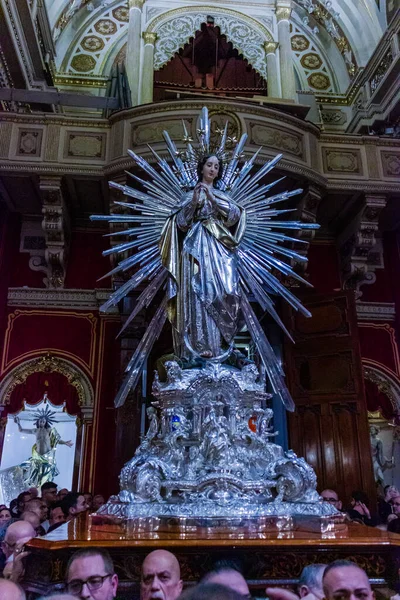 Cospicua, Malta - November 28th, 2025, Statue of Virgin Mary With Radiant Halo Inside Ornate Church During Traditional Procession Ceremony